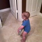 Toddler Running around with Bathroom Scale