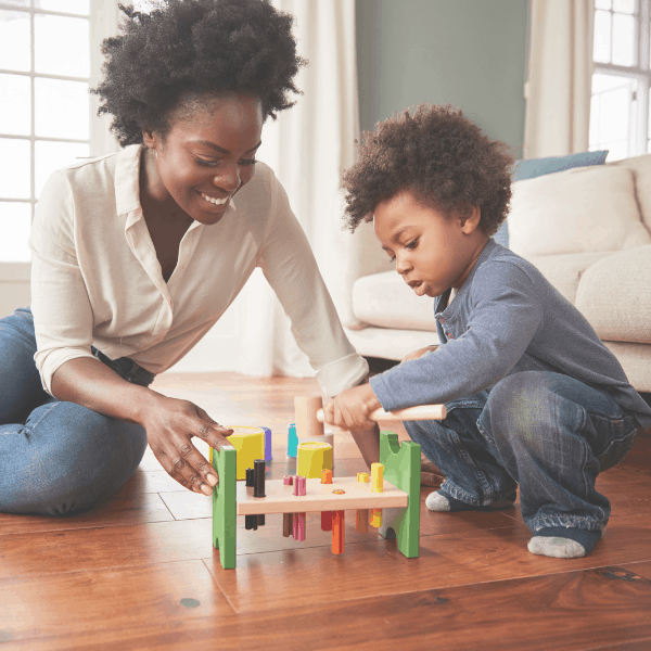 : happy mom playing with her toddler